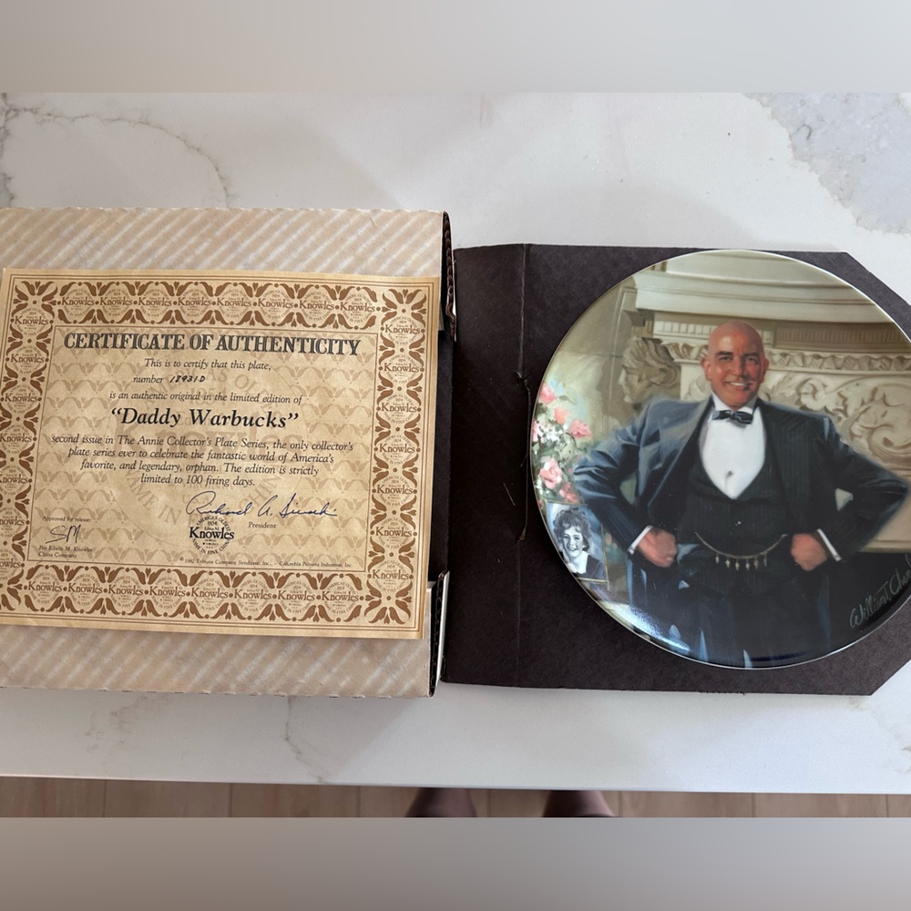 The Edwin M. Knowles "Daddy Warbucks" collectible plate.